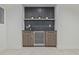 Wet bar area with wine refrigerator and modern backsplash at 5951 S Akron Way, Greenwood Village, CO 80111
