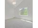 Bright bedroom features a large window providing natural light at 5951 S Akron Way, Greenwood Village, CO 80111