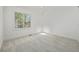 Bright bedroom features a large window providing natural light at 5951 S Akron Way, Greenwood Village, CO 80111