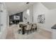 Open-concept dining room with stylish lighting, a modern table setting, and a view into the living room at 5951 S Akron Way, Greenwood Village, CO 80111