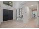 Bright home foyer with high ceilings and an entrance to the home office at 5951 S Akron Way, Greenwood Village, CO 80111