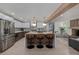 Modern kitchen featuring a large island with bar seating, stainless steel appliances, and an open layout at 5951 S Akron Way, Greenwood Village, CO 80111