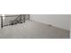Open loft space with neutral carpet and black metal railing at 5951 S Akron Way, Greenwood Village, CO 80111