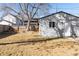 Spacious backyard with a well-maintained lawn and a detached garage at 2675 Kearney St, Denver, CO 80207