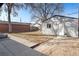 Large backyard features a detached garage, green space, and mature trees at 2675 Kearney St, Denver, CO 80207