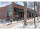 Commercial building with sidewalk dining and a red brick facade at 2675 Kearney St, Denver, CO 80207