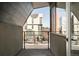 View from the balcony showing the street and modern buildings on a bright day at 267 S Jackson St, Denver, CO 80209