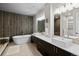 Luxurious bathroom with a freestanding tub, double vanity, and modern fixtures at 32 Jackson St, Denver, CO 80206