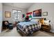 Well-lit bedroom with a comfortable bed, desk, and vibrant decor at 32 Jackson St, Denver, CO 80206
