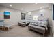 Spacious bedroom with two beds, bench seating, and a view out the window at 32 Jackson St, Denver, CO 80206