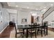 Modern dining room with fireplace featuring a large black table and stylish overhead lighting at 32 Jackson St, Denver, CO 80206