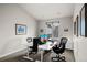 Bright home office featuring two workstations and a large window providing natural light at 32 Jackson St, Denver, CO 80206