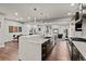 Spacious kitchen featuring a center island with a sink and stainless steel appliances at 32 Jackson St, Denver, CO 80206