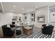 Cozy living room with a modern fireplace, stylish furniture, and a striped area rug at 32 Jackson St, Denver, CO 80206
