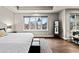 Bright bedroom with hardwood floors, a large window, and a seating area for relaxing at 32 Jackson St, Denver, CO 80206
