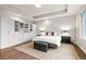 Bright main bedroom with a tray ceiling, built-in wardrobe, and a comfortable rug at 32 Jackson St, Denver, CO 80206
