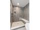 Contemporary shower with modern tile, a glass enclosure, and a built-in bench at 32 Jackson St, Denver, CO 80206