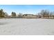 Exterior shot of a building surrounded by a snow-covered field at 9650 Huron St # 22, Thornton, CO 80260