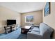 Inviting living room with comfortable sofa, TV, and a cozy sitting area at 9650 Huron St # 22, Thornton, CO 80260