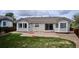 Well-maintained backyard featuring a grassy area, and concrete patio great for entertaining at 10060 Oak Leaf Way, Highlands Ranch, CO 80129