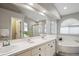 Bathroom with dual sinks, soaking tub, and ample lighting, creating a serene and functional space at 10060 Oak Leaf Way, Highlands Ranch, CO 80129