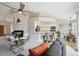 Inviting living space with open bar to kitchen, fireplace, and cozy seating at 10060 Oak Leaf Way, Highlands Ranch, CO 80129