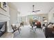Open living space showcasing a fireplace, sliding doors, and a casual dining area at 10060 Oak Leaf Way, Highlands Ranch, CO 80129