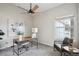 Home office with neutral walls, ceiling fan, a window, and sleek desk setup for a productive workspace at 10060 Oak Leaf Way, Highlands Ranch, CO 80129