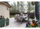 Backyard patio featuring an outdoor dining table and lush landscaping at 2260 S Jackson St, Denver, CO 80210