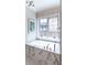 This bathroom features a soaking tub with marble surround and plenty of natural light at 2260 S Jackson St, Denver, CO 80210
