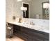 This bathroom features a marble countertop, dark wood cabinets, and a makeup vanity at 2260 S Jackson St, Denver, CO 80210