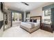 Primary bedroom with large windows, neutral decor, and a cozy fireplace at 2260 S Jackson St, Denver, CO 80210