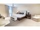 Serene bedroom featuring a king-size bed, plush carpeting, and elegant decor at 2260 S Jackson St, Denver, CO 80210
