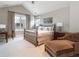 Bright bedroom with vaulted ceiling and brass bed at 2260 S Jackson St, Denver, CO 80210