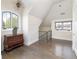 Bright bonus room features hardwood floors, arched window and staircase at 2260 S Jackson St, Denver, CO 80210