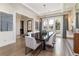 Dining room with a dark wood table, white chairs, and french doors at 2260 S Jackson St, Denver, CO 80210