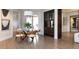 Bright dining room with modern chandelier and seamless access to the outdoor space at 2260 S Jackson St, Denver, CO 80210