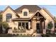 Beautiful stone and brick home with a charming front porch and manicured landscaping at 2260 S Jackson St, Denver, CO 80210
