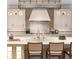 Gourmet kitchen features custom cabinets, marble backsplash, and professional-grade appliances at 2260 S Jackson St, Denver, CO 80210
