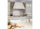 Close up of a modern kitchen with white marble countertops and a neutral backsplash at 2260 S Jackson St, Denver, CO 80210