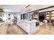 Open concept kitchen with marble island, built-in microwave and stainless steel appliances at 2260 S Jackson St, Denver, CO 80210