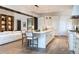 Well-lit open concept kitchen with a marble island and stainless steel appliances at 2260 S Jackson St, Denver, CO 80210