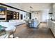 Open concept living room with a modern kitchen and bright white sofa at 2260 S Jackson St, Denver, CO 80210