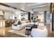 Spacious living room with a white sofa, open to the kitchen and outdoor seating area at 2260 S Jackson St, Denver, CO 80210