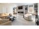 Cozy living room features a sleek fireplace, comfortable seating, and recessed lighting at 2260 S Jackson St, Denver, CO 80210