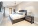 Spacious main bedroom features a ceiling fan, soft carpet and ensuite bath at 2260 S Jackson St, Denver, CO 80210
