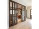 This office features glass doors, hardwood floors, and custom built-ins at 2260 S Jackson St, Denver, CO 80210