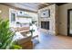 Outdoor patio with stone fireplace, covered seating, and outdoor kitchen area at 2260 S Jackson St, Denver, CO 80210
