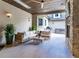 Inviting outdoor patio with comfortable seating, ceiling fan, and stone fireplace at 2260 S Jackson St, Denver, CO 80210