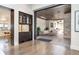 Indoor-outdoor patio boasts comfortable seating, ceiling fans, and a stone accent wall at 2260 S Jackson St, Denver, CO 80210